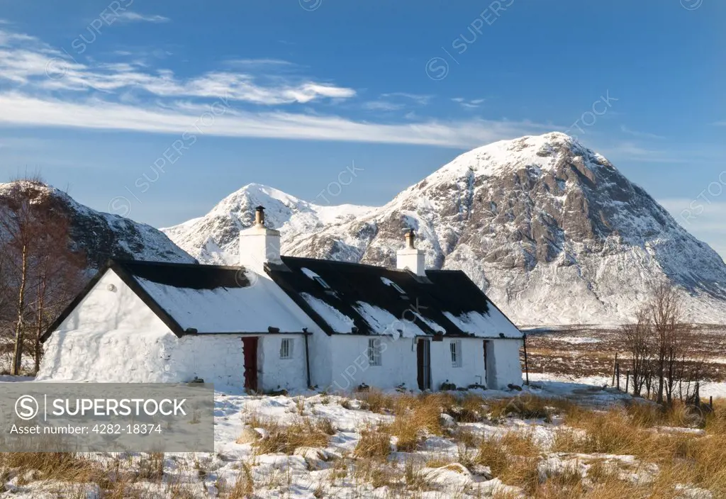 Scotland, Highland, Glencoe. A snow covered landscape featuring Black Rock cottage in Glencoe.