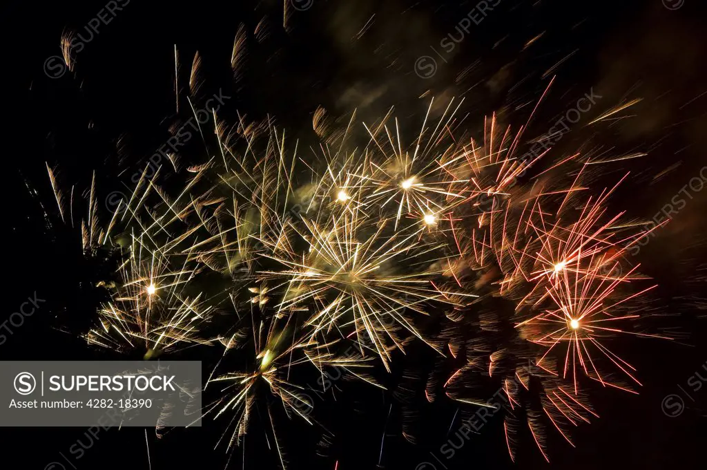 England, North Yorkshire, -. Spectacular trails of light from fireworks exploding in the evening sky on bonfire night.