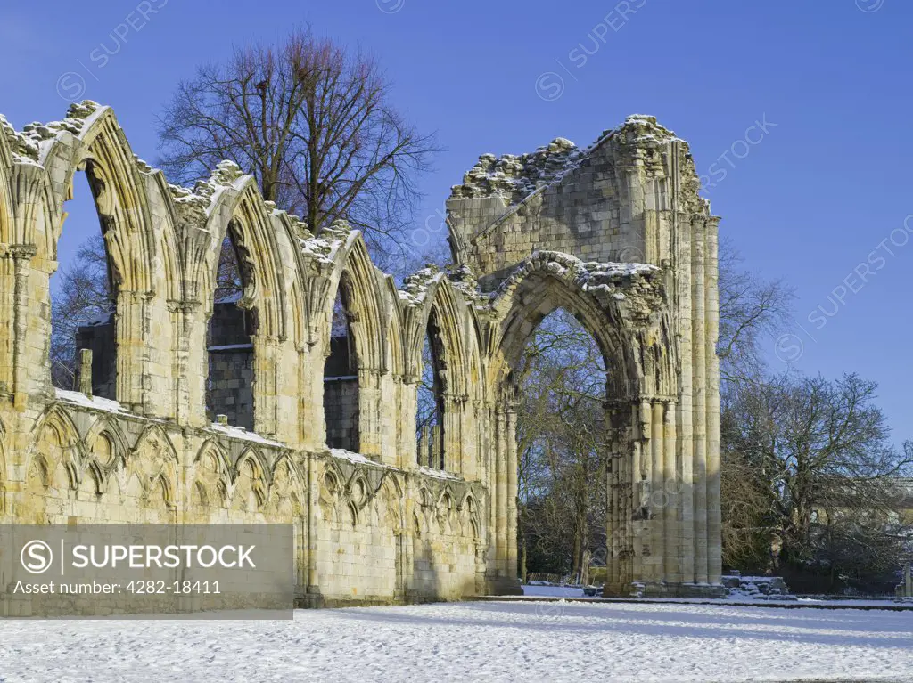 England, North Yorkshire, York. Snow covering the ruins of St Mary's Abbey in the Yorkshire Museum Gardens in York.