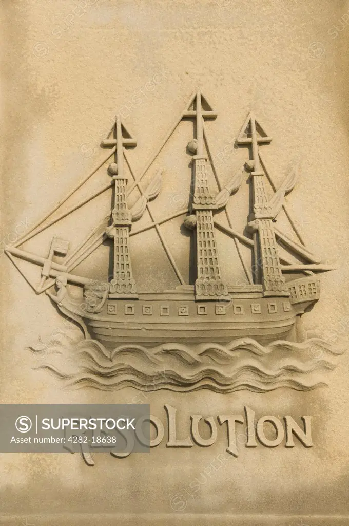 England, North Yorkshire, Whitby. Stone carving of the ship Resolution on the base of the Captain James Cook statue which overlooks Whitby harbour. All Captain Cook's four ships - Endeavour, Resolution, Adventure and Discovery were built at Whitby.