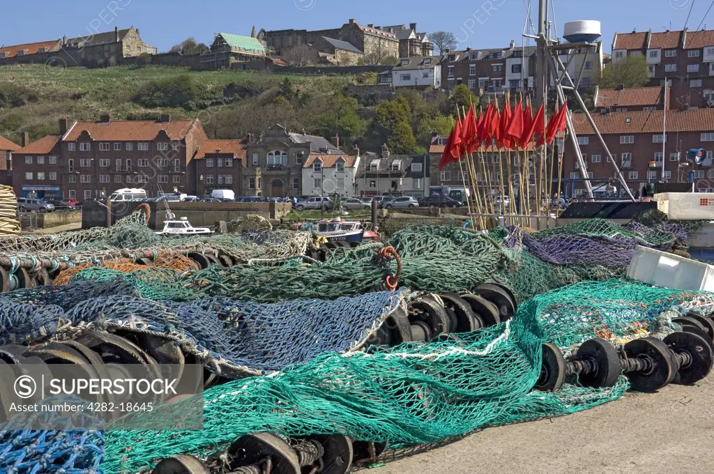 England, North Yorkshire, Whitby. Trawling nets laid out on the Whitby quayside.