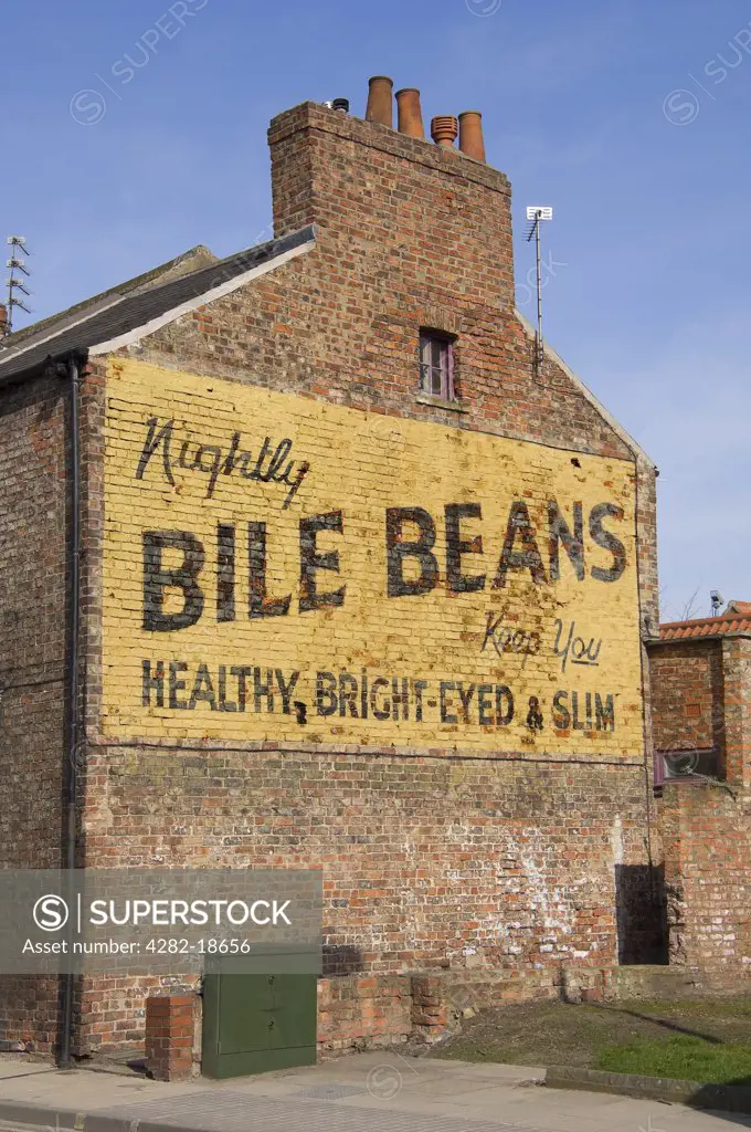 England, North Yorkshire, York. Old advertising hoarding for Bile beans on the side of a brick building.