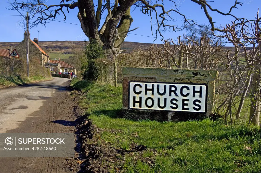 England, North Yorkshire, Church Houses. Stone road sign outside the village of Church Houses in Farndale.