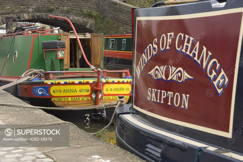 England, North Yorkshire, Skipton. Barges moored on the Leeds to Liverpool canal basin.