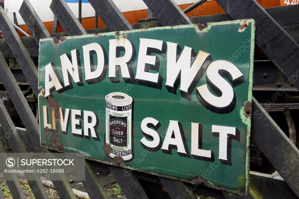 England, North Yorkshire, Goathland. Old rusty Andrews liver salt sign on the North York Moors Railway platform at Goathland station.