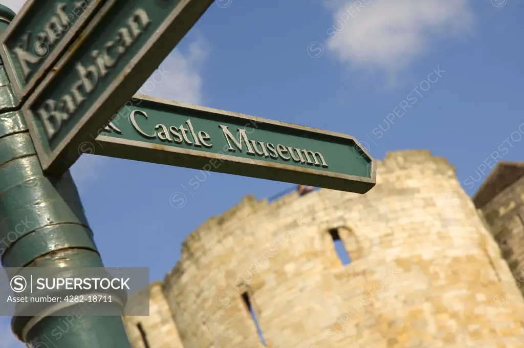 England, North Yorkshire, York. City of York tourist direction signpost outside Cliffords Tower directing tourists to the Castle Museum.