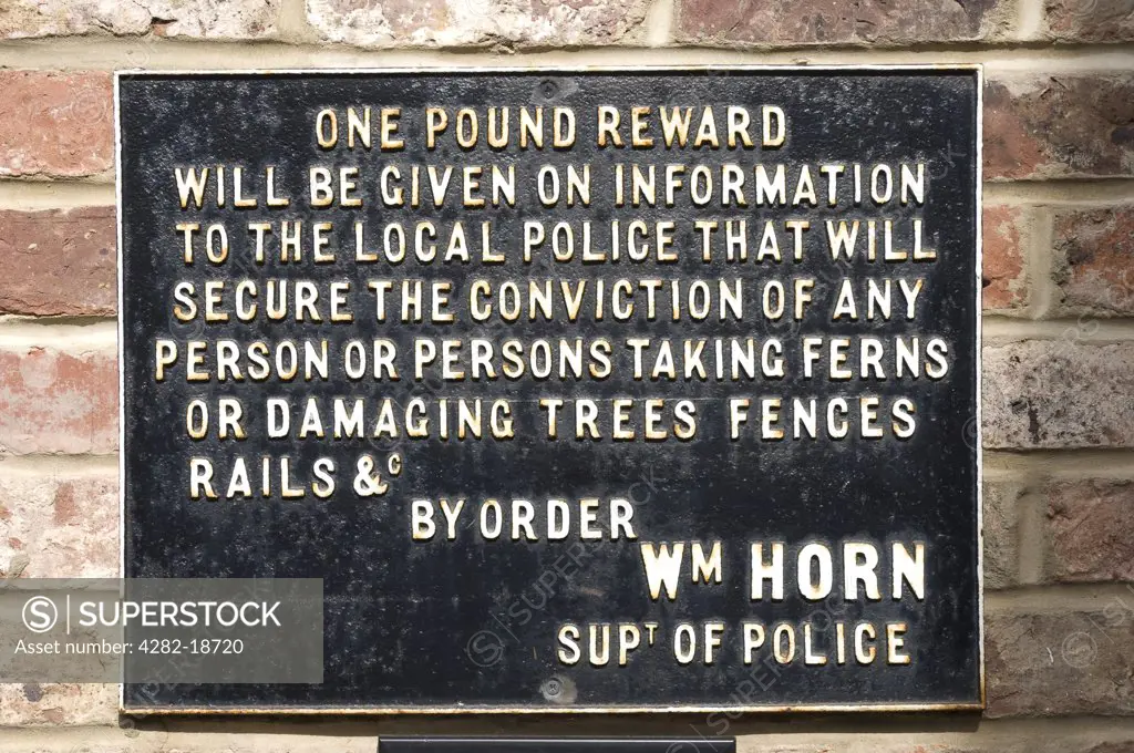 England, North Yorkshire, Ripon. Railway sign offering a reward of one pound for information to secure a conviction for persons or person taking ferns or damaging trees fences rails.