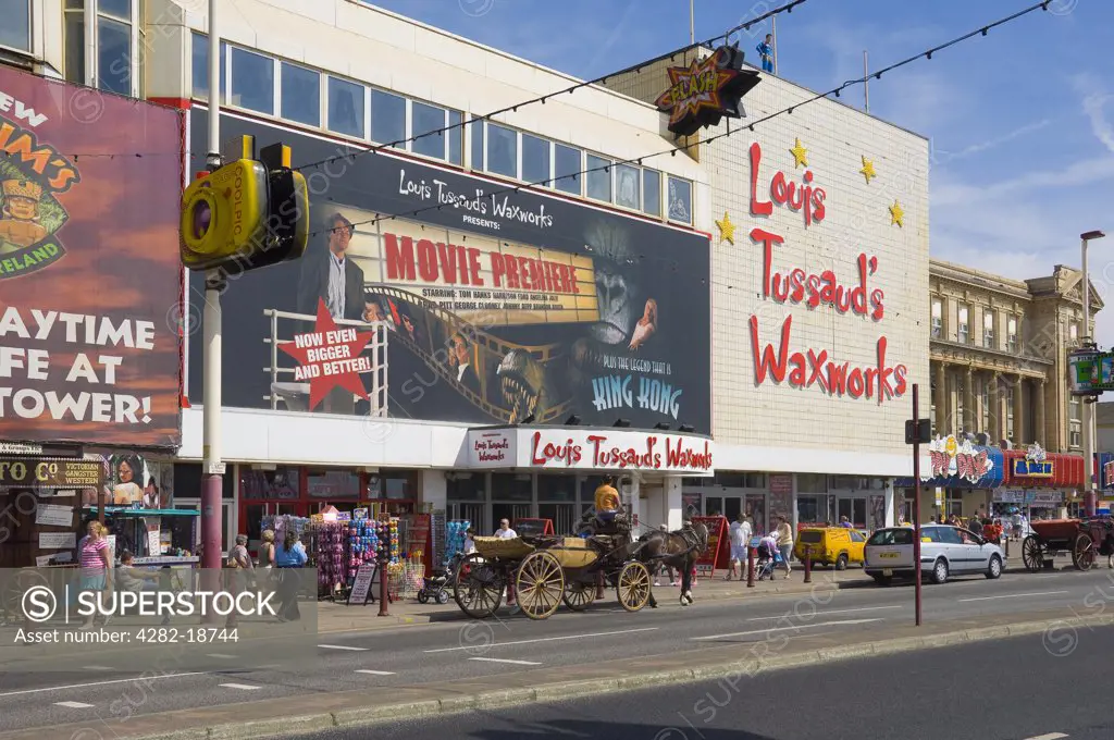 England, Lancashire, Blackpool. Horse and carriage outside Louis Tussauds Waxworks on the Golden Mile in Blackpool.
