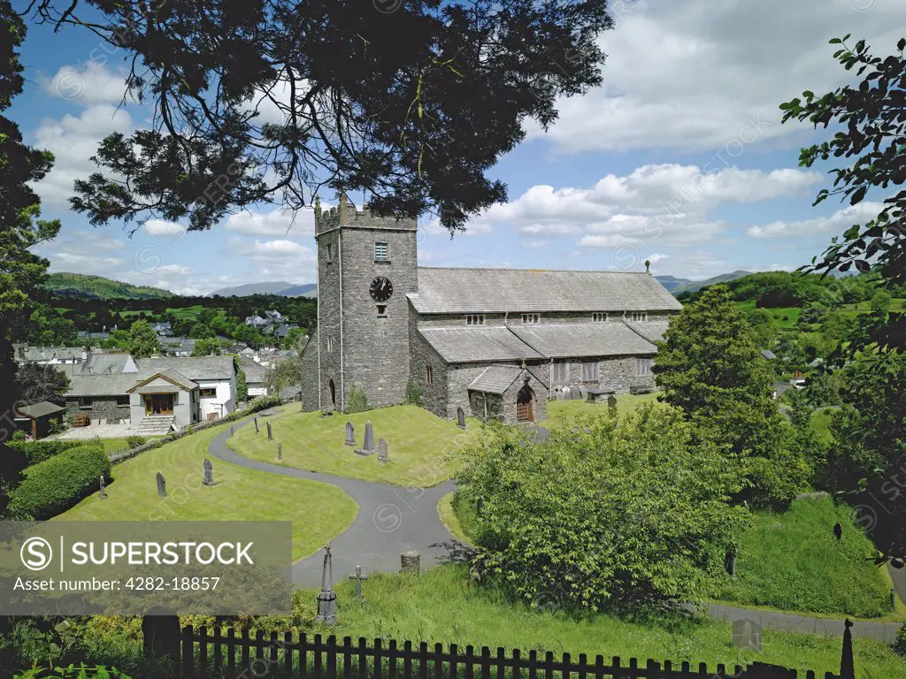 England, Cumbria, Hawkshead. The 15th century parish church of St Michael and All Angels in Hawkshead. William Wordsworth, who went to school in Hawkshead, used to like sitting at the top of the churchyard.