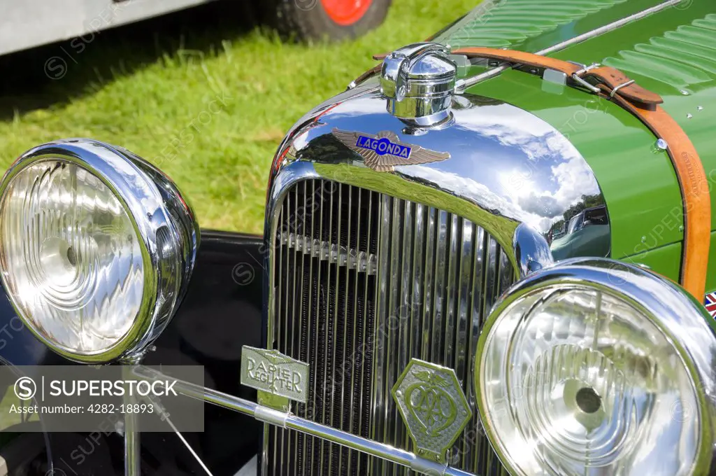 England, North Yorkshire, -. The front of a vintage green Lagonda car.