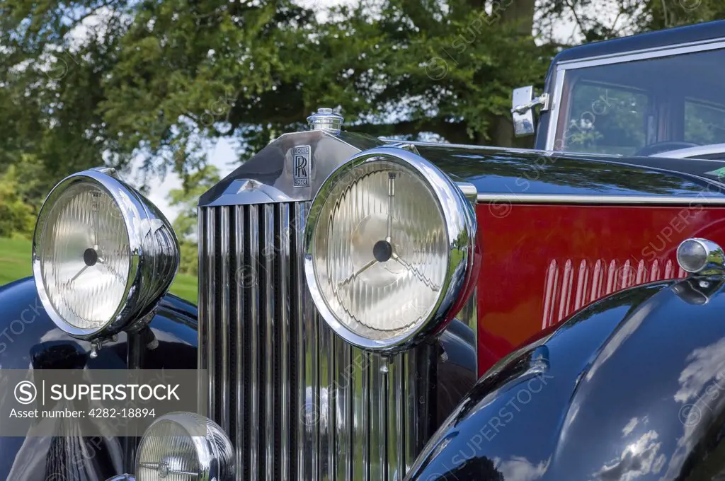 England, North Yorkshire, -. The front of a vintage red Rolls Royce car.