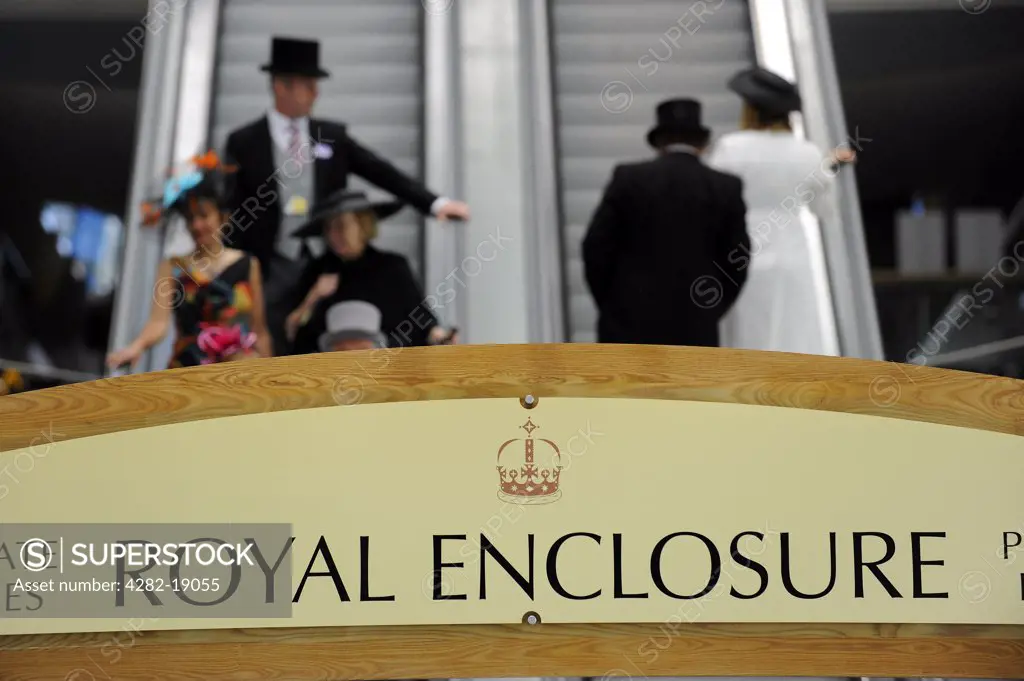 England, Berkshire, Ascot. Smartly dressed racegoers on the escalators leading to and from private boxes in the Royal Enclosure during day two of Royal Ascot 2010.