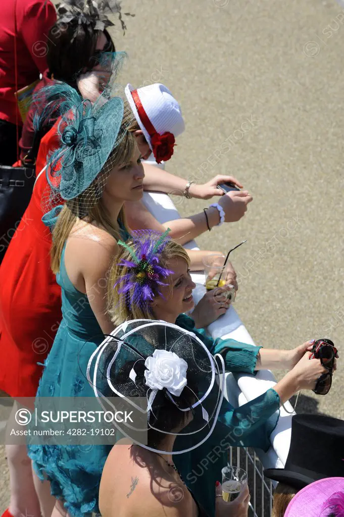 England, Berkshire, Ascot. Smartly dressed women in the grandstand enclosure during day three of Royal Ascot 2010.
