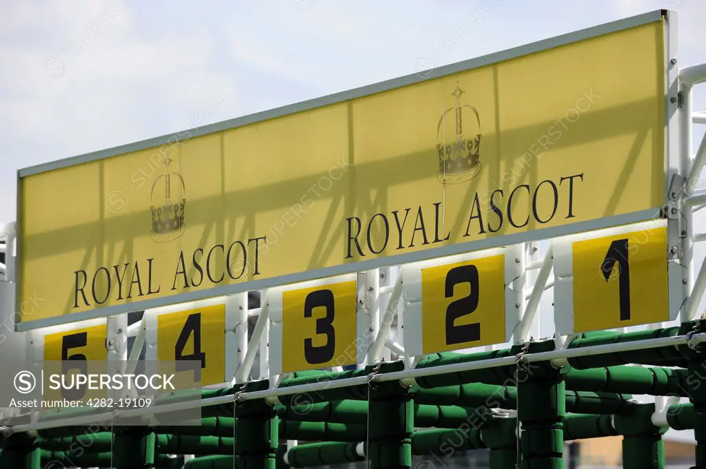 England, Berkshire, Ascot. Royal Ascot signage on the top of the starting stalls at Royal Ascot 2010.