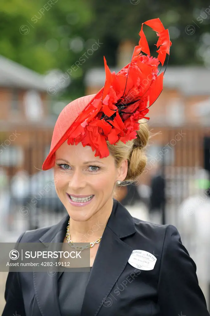 England, Berkshire, Ascot. A female racegoer wearing an elaborate hat attending Day One of Royal Ascot.