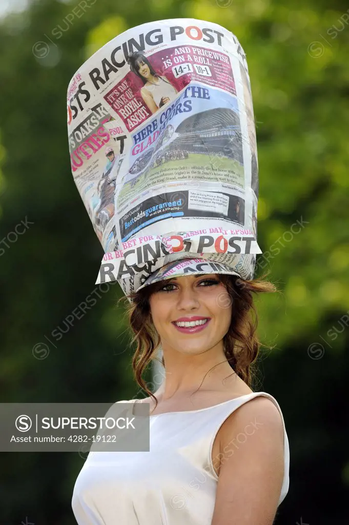 England, Berkshire, Ascot. A female racegoer wearing a racing post themed hat attending day two of Royal Ascot 2010.
