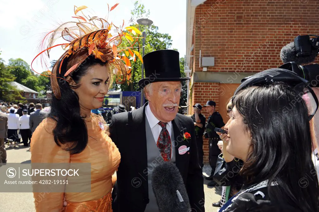 England, Berkshire, Ascot. Bruce Forsyth being interviewed during day three of Royal Ascot 2010.