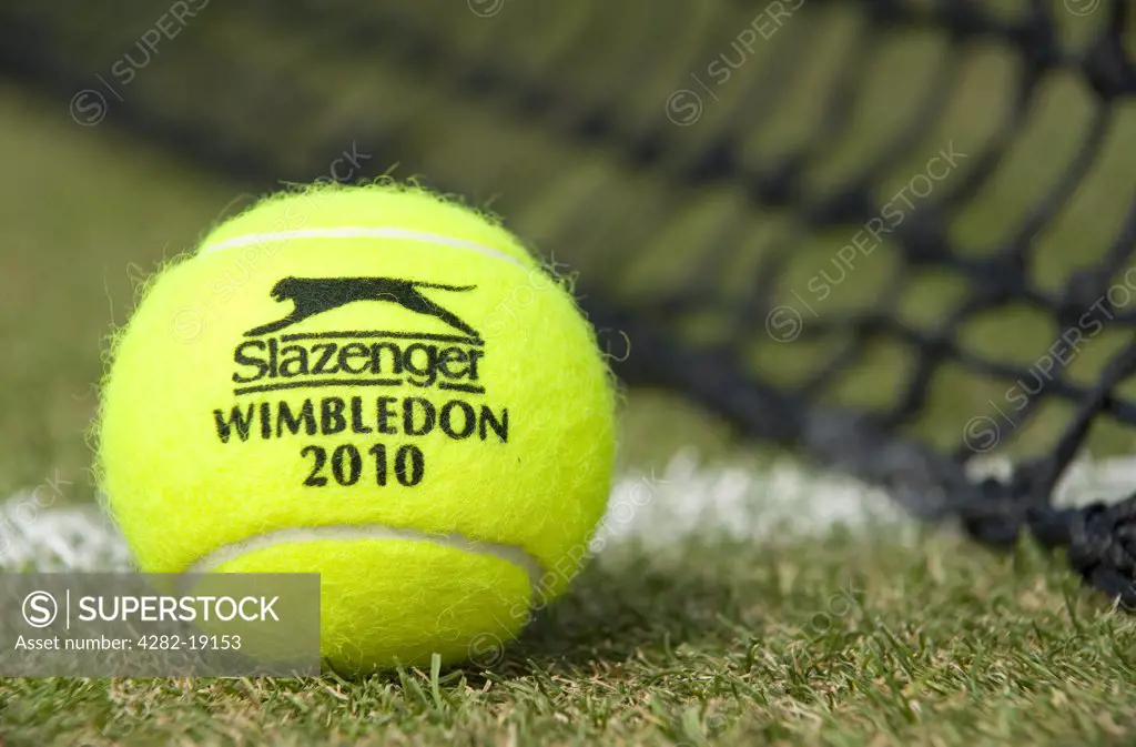England, London, Wimbledon. Wimbledon 2010 Slazenger tennis ball on a grass court during the Wimbledon Tennis Championships 2010.