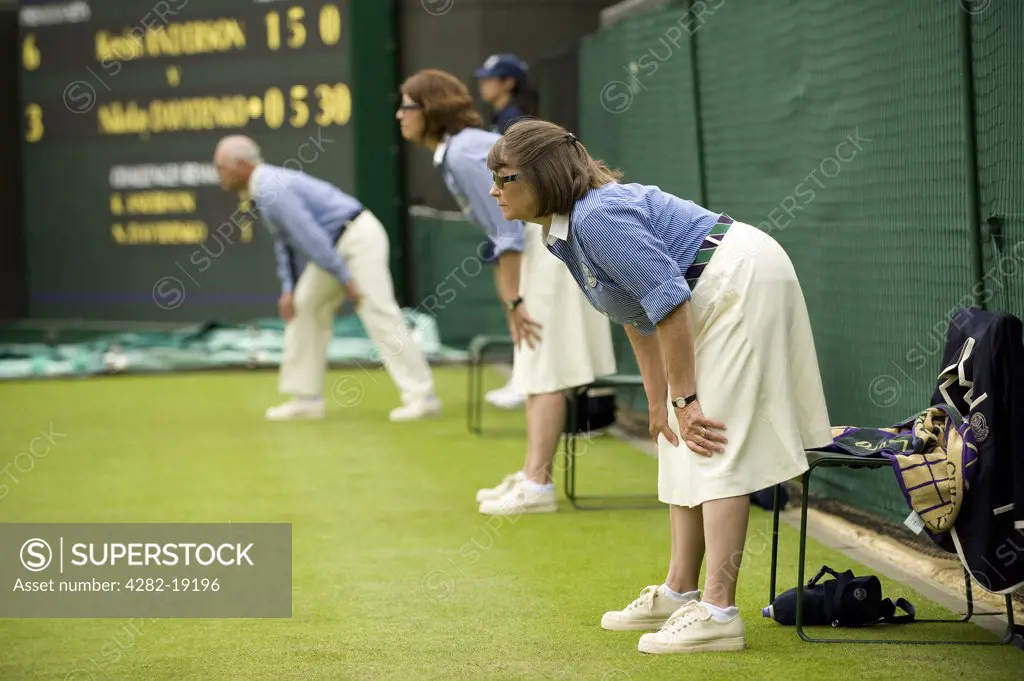England, London, Wimbledon. Attentive line judges watching the play on Court 1 during the Wimbledon Tennis Championships 2010.