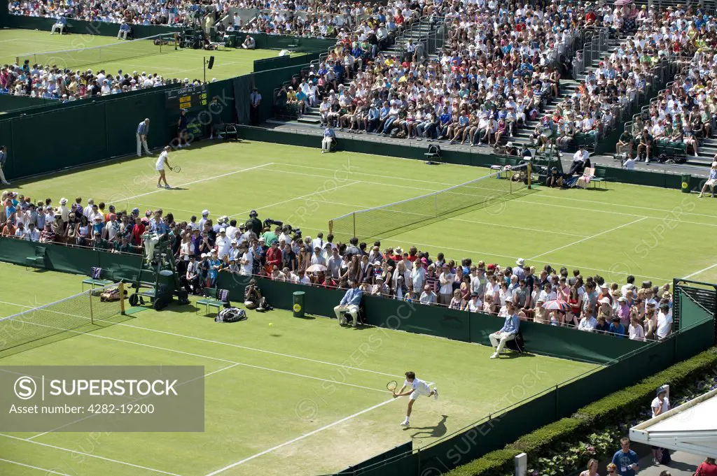 England, London, Wimbledon. Matches on the southern courts including Courts 6 and 5 in the foreground at the Wimbledon Tennis Championships 2010.