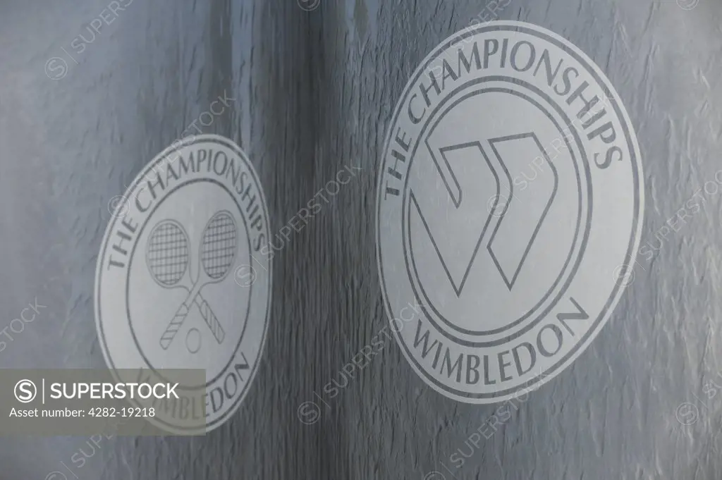 England, London, Wimbledon. The Championships Wimbledon logos on a water feature at the Wimbledon Tennis Championships 2010.