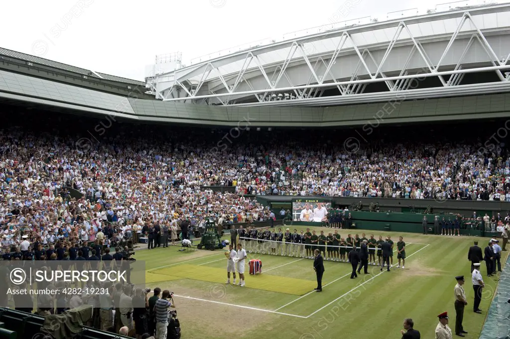 England, London, Wimbledon. Rafael Nadal and Tomas Berdych presenting their trophies to the worlds media on Centre Court during the prize presentation after the mens singles final at the Wimbledon Tennis Championships 2010.