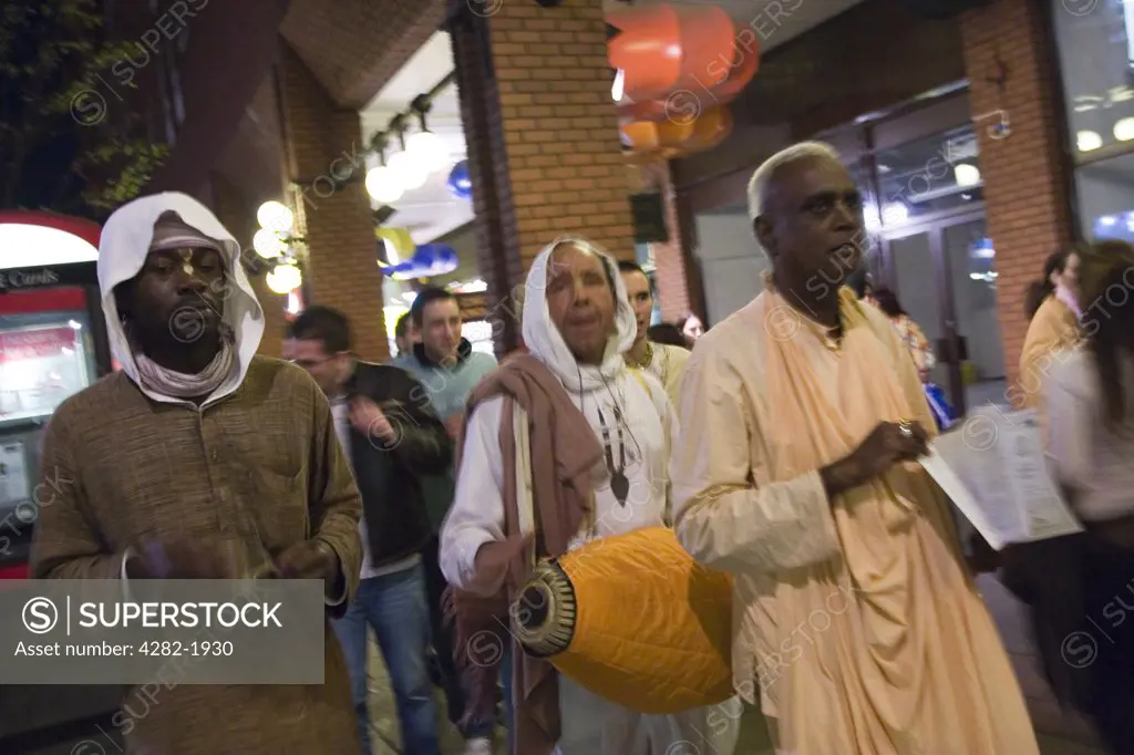 England, London, Charing Cross Road. Followers of Hare Krishna singing their mantra.