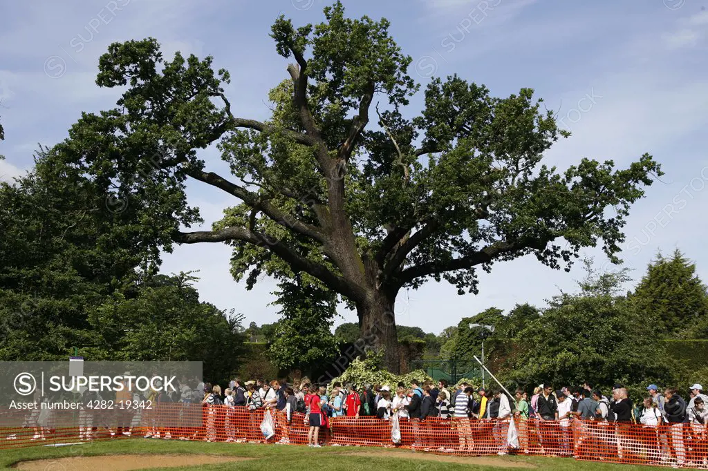 England, London, Wimbledon. Spectators queue to buy tickets for the first day of the championships at the Wimbledon Tennis Championships 2008.