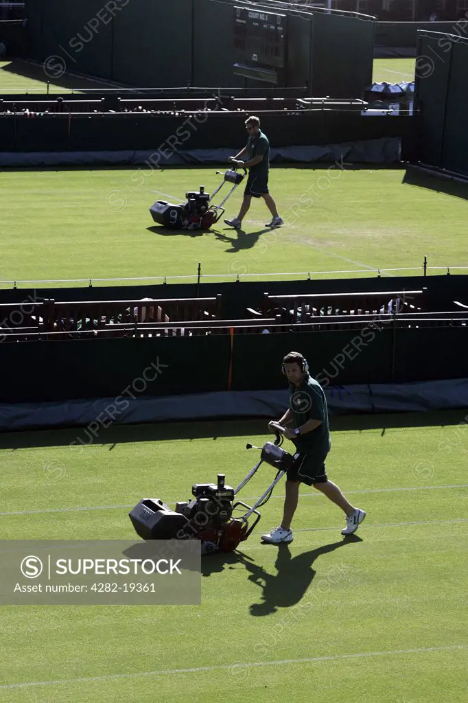 England, London, Wimbledon. The grass is cut on the outside courts during the Wimbledon Tennis Championships 2008.