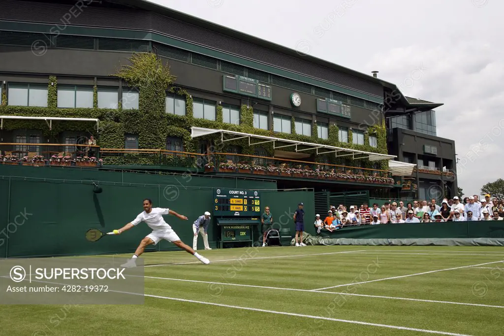 England, London, Wimbledon. Action on court 3 with centre court in the background during the Wimbledon Tennis Championships 2008.