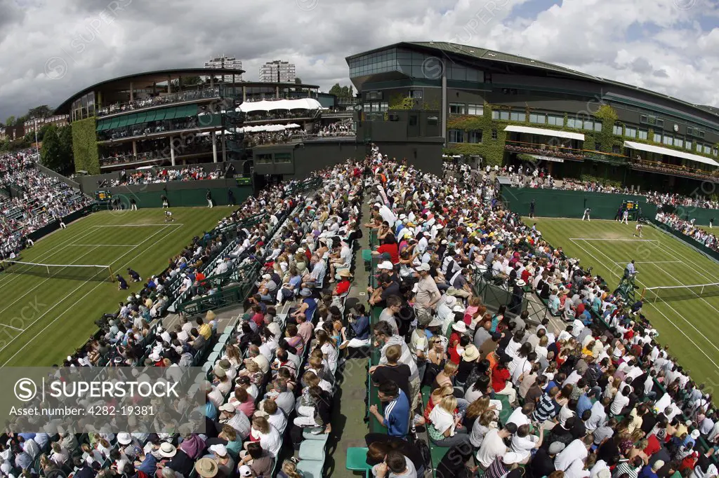 England, London, Wimbledon. View from the crows nest of the crowds watching games on Court 2 and Court 3 during the Wimbledon Tennis Championships 2008.