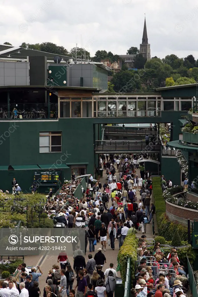 England, London, Wimbledon. View of the crowds using St Mary's Walk at the Wimbledon Tennis Championships 2008.