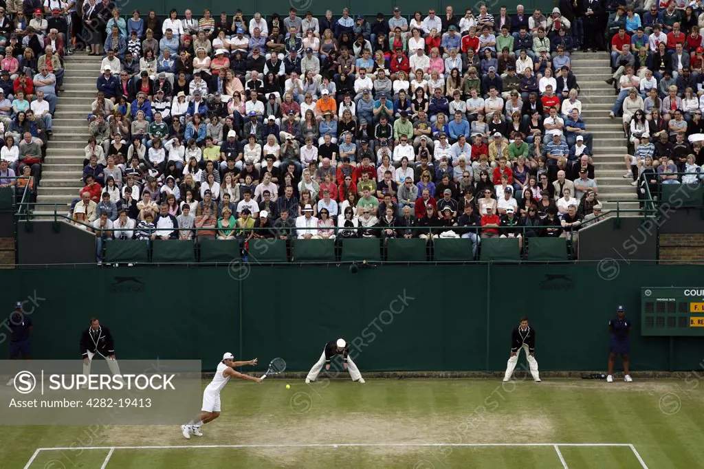 England, London, Wimbledon. Crowds watch a match on court 18 during the Wimbledon Tennis Championships 2008.