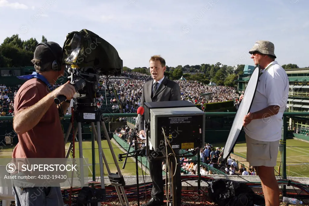 England, London, Wimbledon. An outside broadcast is filmed on the broadcast centre roof at the Wimbledon Tennis Championships 2008.