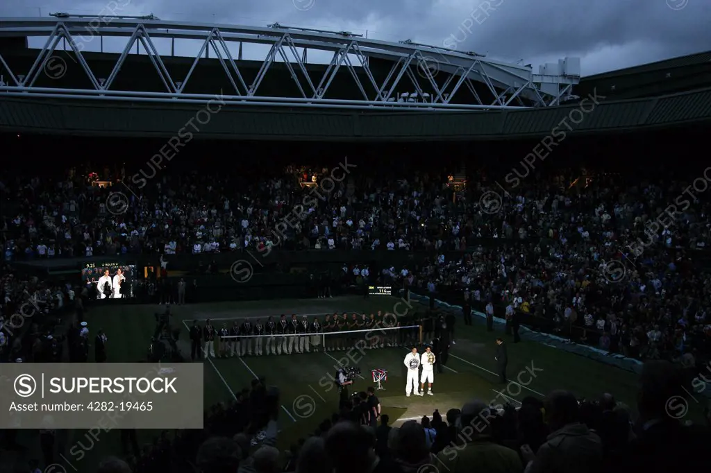 England, London, Wimbledon. View of Centre Court in the darkness during the presentation after the Men's Singles Final played between Rafael Nadal and Roger Federer at the Wimbledon Tennis Championships 2008.