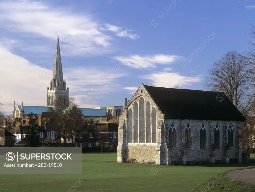 England, West Sussex, Chichester. Grey Friars choir building (circa 1269) in Priory Park inside the city walls, with Chichester Cathedral in the city centre beyond.