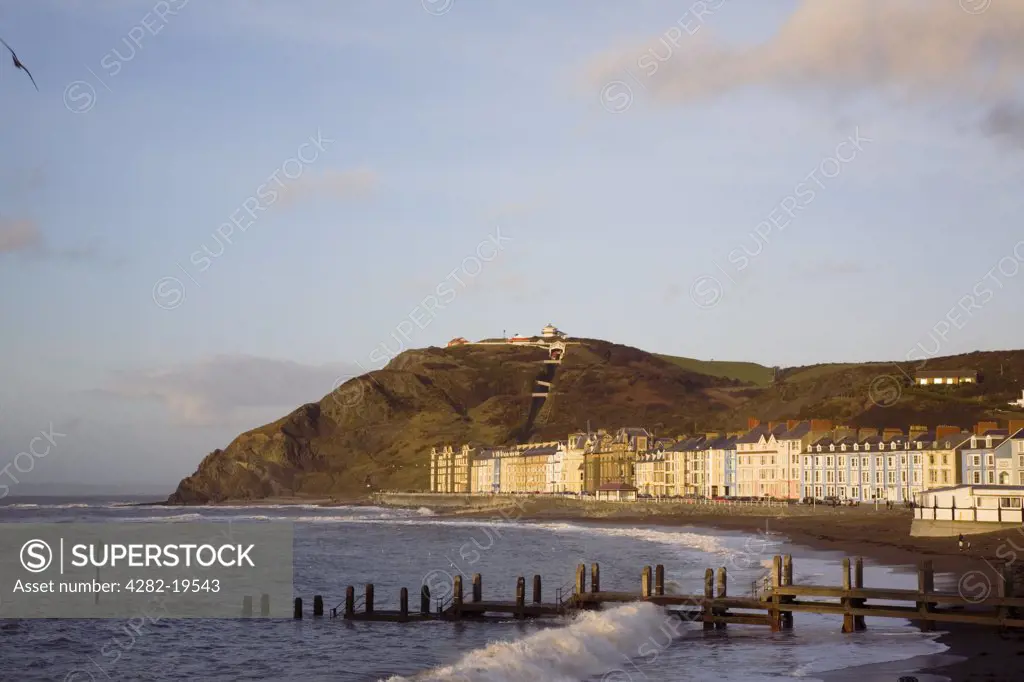 Wales, Ceredigion, Aberystwyth. Beach and colourful Victorian seafront buildings. The harbour was once one of the busiest in Wales and is fed by the rivers Ystwyth and Rheidol, which is the steepest river in Britain.