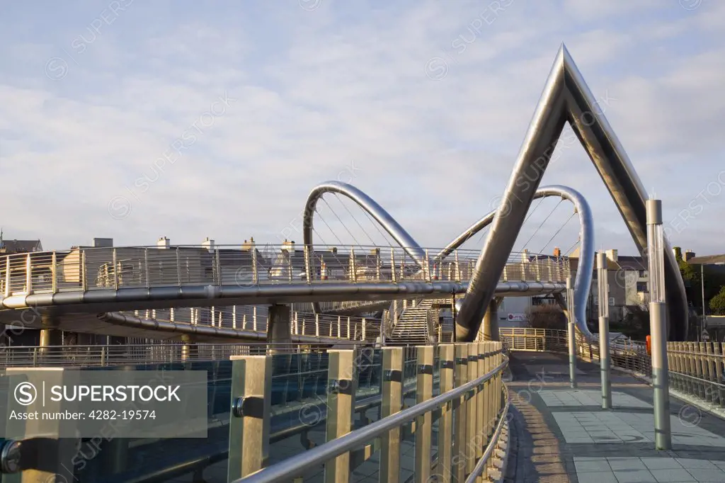North Wales, Anglesey, Holyhead. Celtic Gateway Bridge and pedestrian walkway. The duplex stainless steel arches form a support designed to represent a sailing ship.