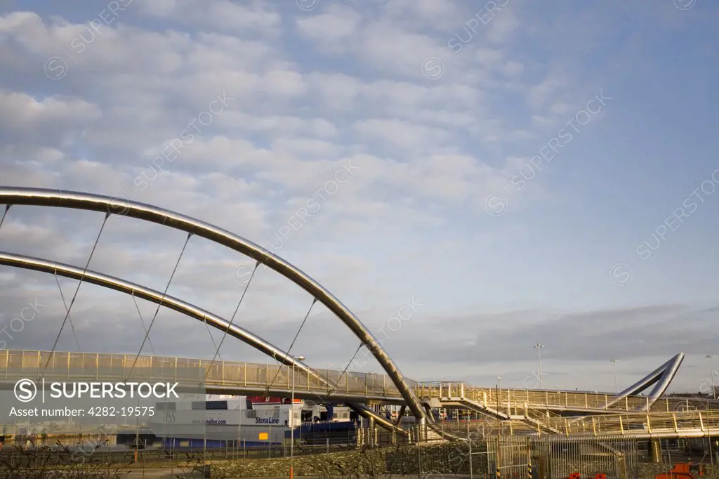 North Wales, Anglesey, Holyhead. Celtic Gateway Bridge and pedestrian and cyclist footbridge. The duplex stainless steel arches form a support designed to represent a sailing ship.