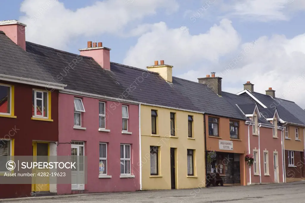 Republic of Ireland, County Kerry, Sneem. A row of traditional painted houses in North Square on Ring of Kerry tourist route round Iveragh Peninsula.