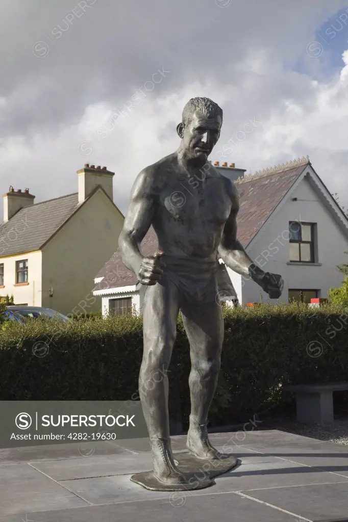 Republic of Ireland, County Kerry, Sneem. Statue of Steve 'Crusher'  Casey in South Square on Ring of Kerry tourist route round Iveragh Peninsula.  Undefeated Heavyweight wrestling champion of world from 1938 to1947.
