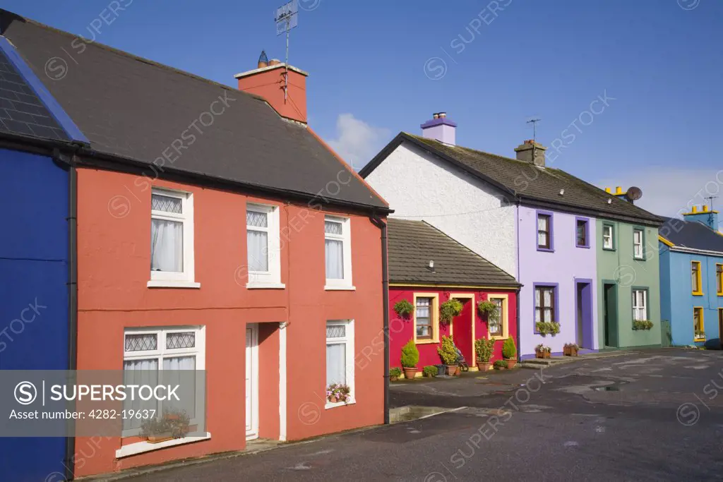 Republic of Ireland, County Cork, Eyeries. Row of colourful traditional houses in main street of village on Ring of Beara tourist route round Beara peninsula.