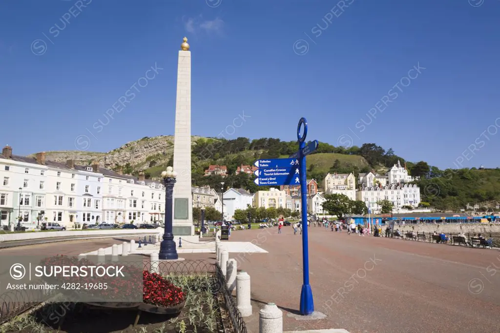 North Wales, Conwy, Llandudno. Tourist sign and Cenotaph on North Parade promenade in Llandudno.