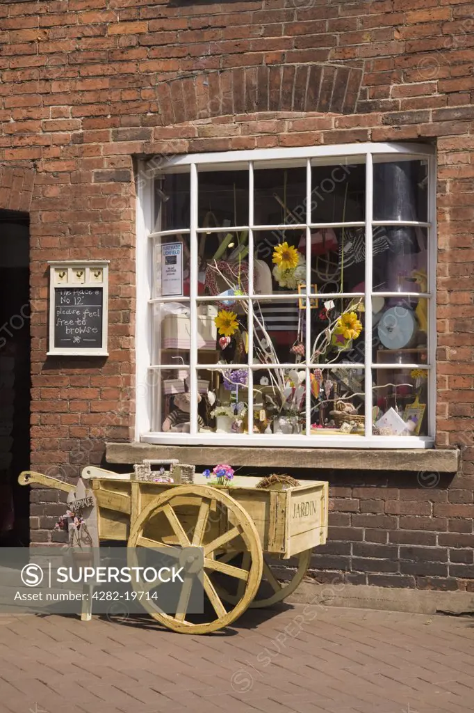 England, Staffordshire, Lichfield. An old shop front window displaying gifts in Dam Street in the historic city centre.