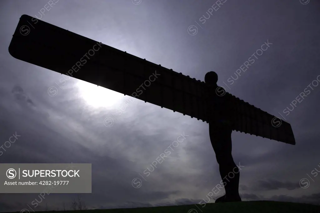 England, Tyne and Wear, Gateshead. Silhouette of the Angel of the North near Gateshead.