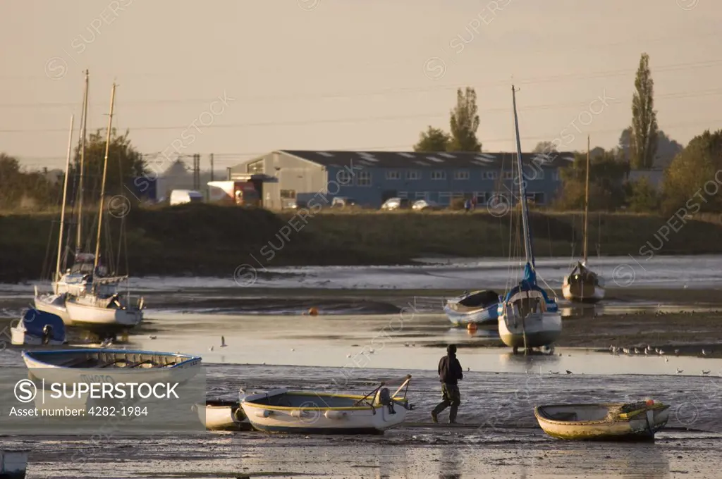 England, Essex, River Stour. Boats on the mudflats of the river Stour between Manningtree and Cattawade.