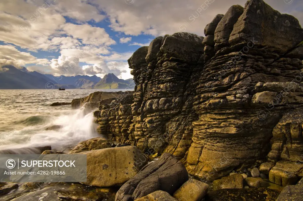 Scotland, Isle of Skye, Elgol. Waves crashing onto rocks at Elgol on the Isle of Skye.