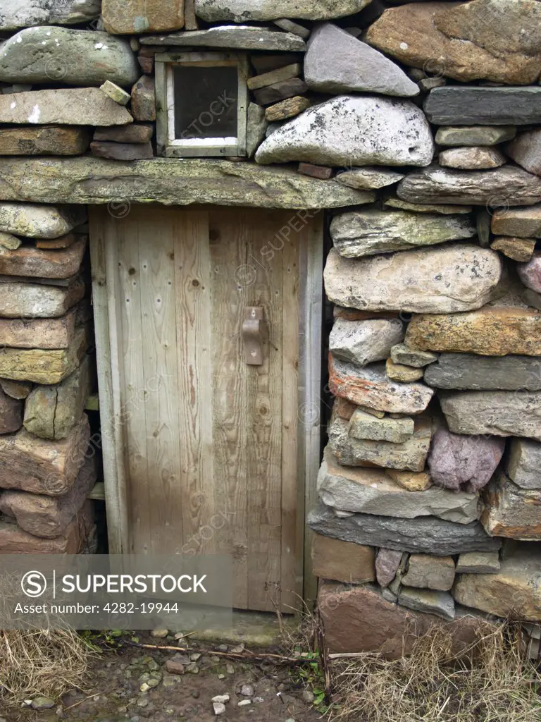 Scotland, Shetland, Huxter. Door of renovated water mill at Huxte on Shetland.