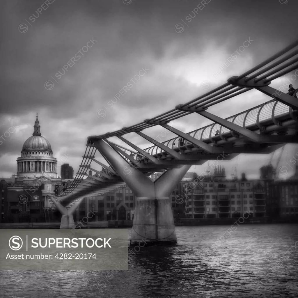 England, London, Millenium Bridge. The River Thames and the Millennium Bridge. The bridge is the first pedestrian river crossing over the Thames in central London for more than a century.