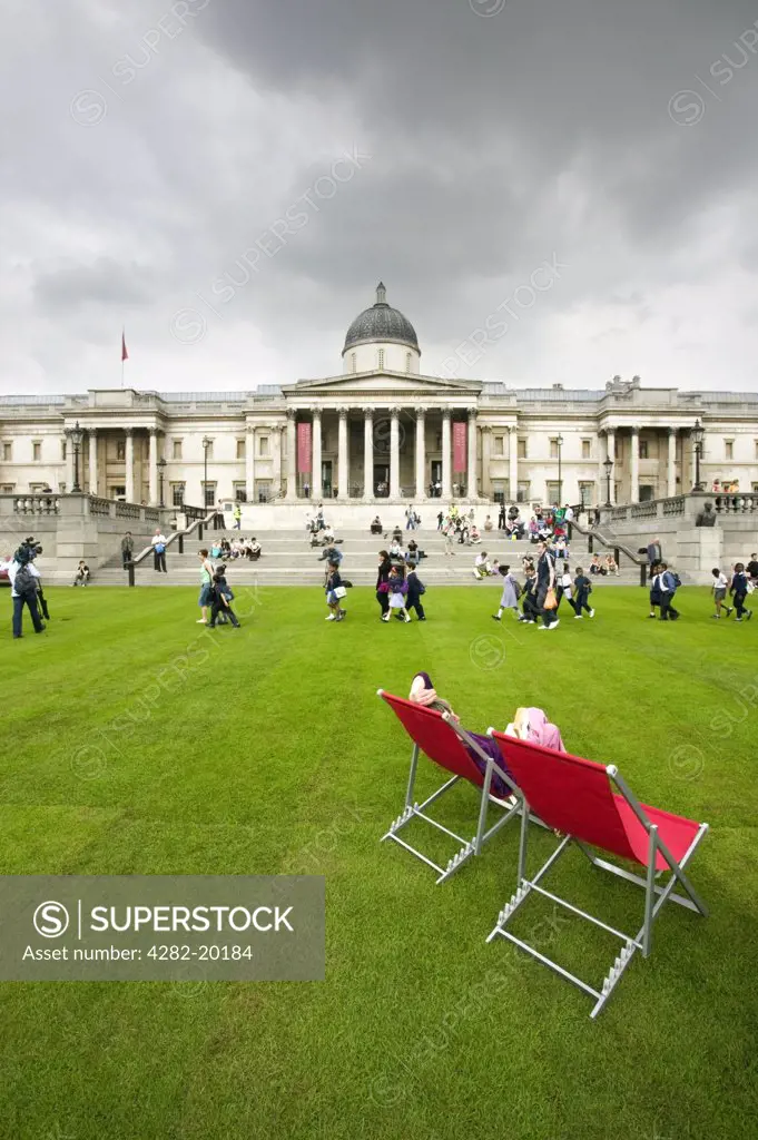 England, London, Trafalgar Square. Trafalgar Square with turf and deckchairs. In May 2007, more than 2,000 square metres of turf were laid as part of Visit London's campaign to promote green spaces and villages in the city.